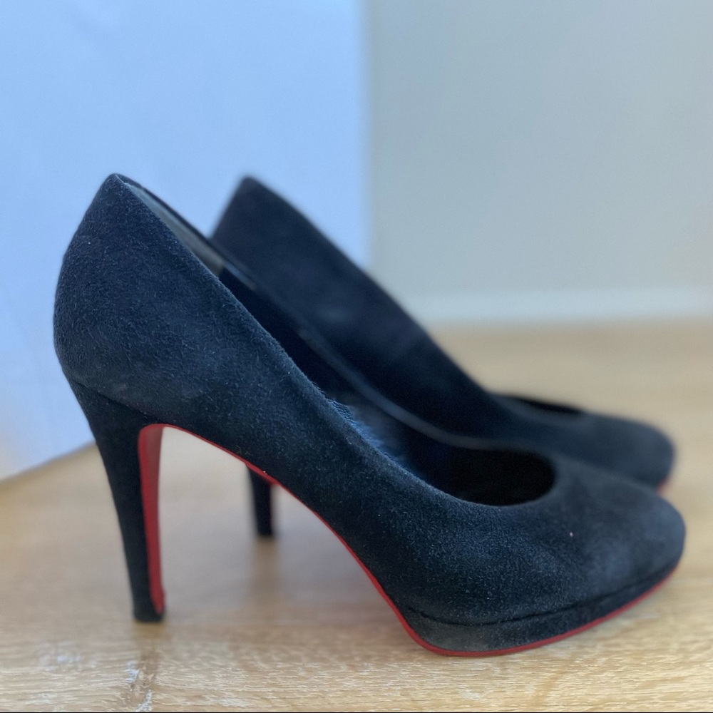 Black suede pumps